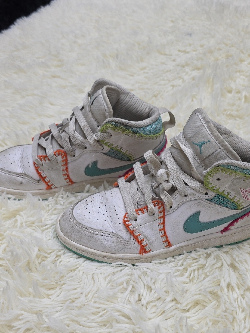 Nike Kids White Sneakers with Teal Swoosh and Multicolor Stitching